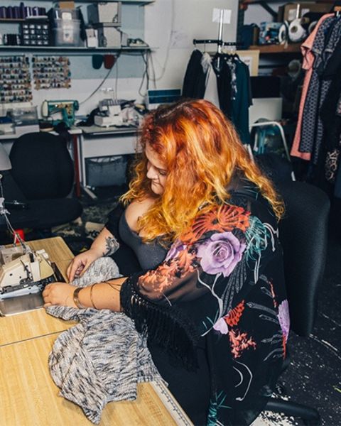 Claire Doody works on a garment for her plus-size fashion label, Copper Union.